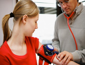 Teenage Girl Having Her Blood Pressure Checked